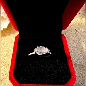 Raw rose quartz ring with diamond accents set in sterling silver